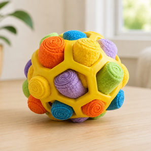 Colorful Snuffle Ball dog enrichment toy with polar fleece and TPR base